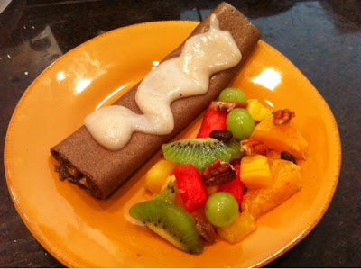 RAW Banana crepes with chocolate filling and coconut cream sauce.